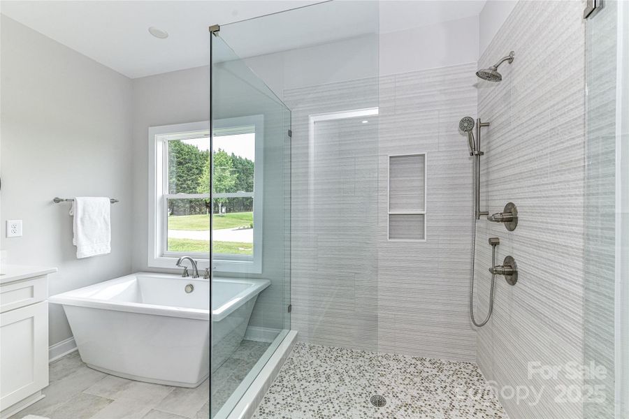 Primary Bath features dual, quartz vanity, soaking tub & large, all glass, frameless shower! Primary Bath features dual, quartz vanity, soaking tub & large, all glass, frameless shower!