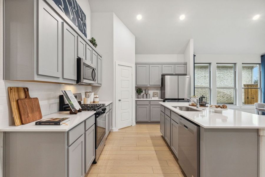 Kitchen in the Claret home plan by Trophy Signature Homes