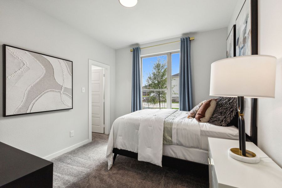 Bedroom in the Emmy II home plan by Trophy Signature Homes - REPRESENTATIVE PHOTO