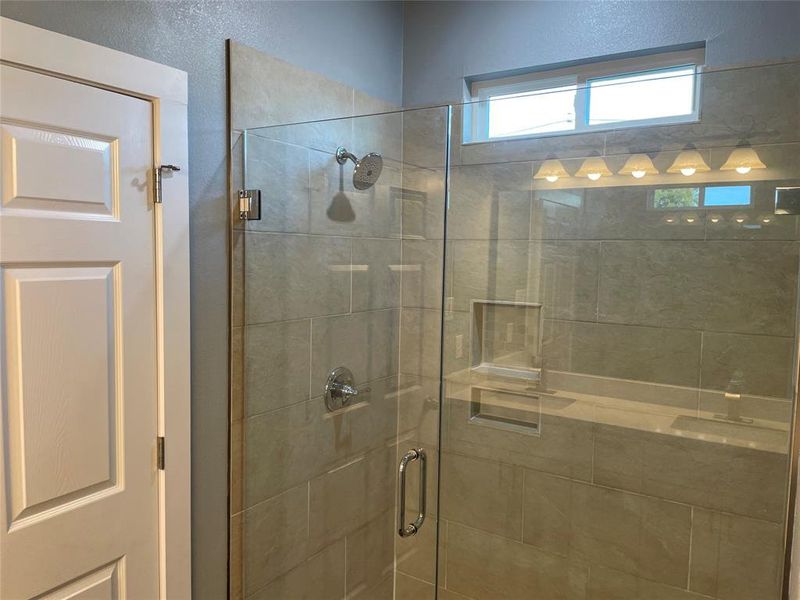 Bathroom featuring an enclosed shower