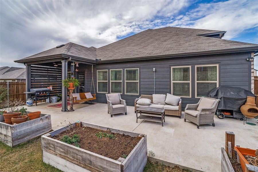 View of patio / terrace featuring a vegetable garden, an outdoor living space, and area for grilling View of patio / terrace featuring a vegetable garden, an outdoor living space, and area for grilling