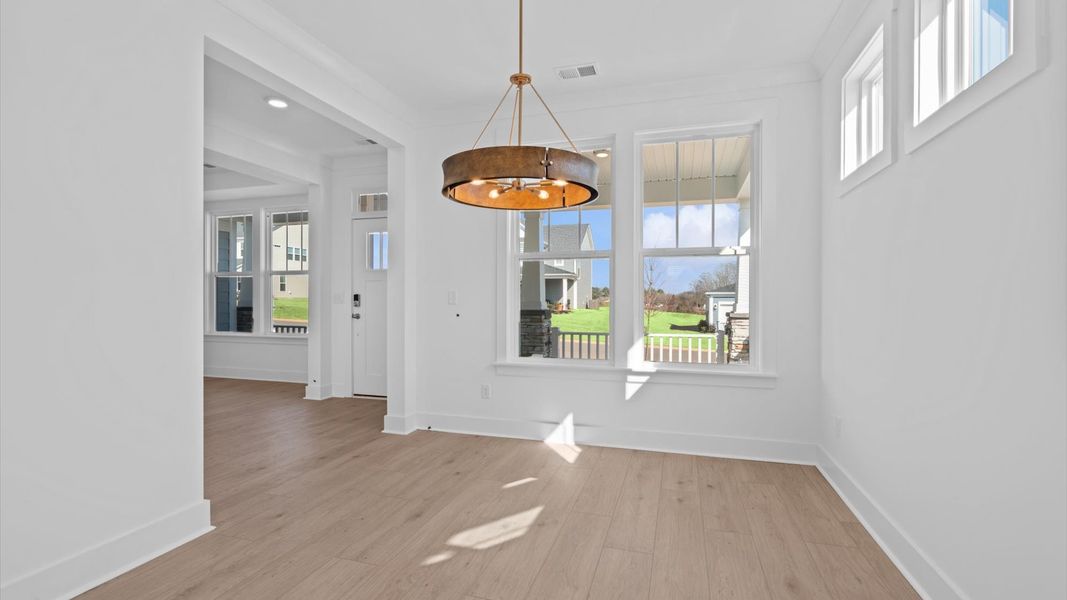 Established charm meets modern elegance in this first-rate dining room by DRB Homes