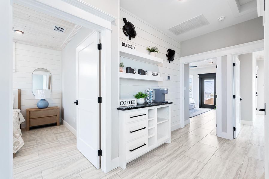 Hall featuring wood walls and baseboards Hall featuring wood walls and baseboards