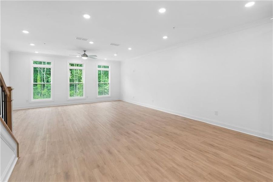 The main floor features an open-concept layout that seamlessly connects the family room, dining area, and kitchen—creating an ideal space for everyday living and entertaining.