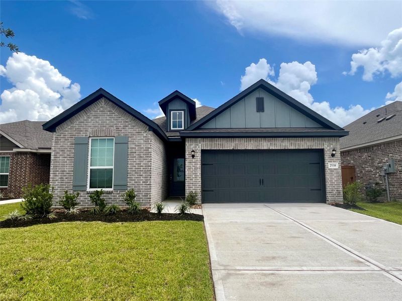 Front exterior of a home in the Canterra Creek community, located in Iowa Colony, TX (Image 1).