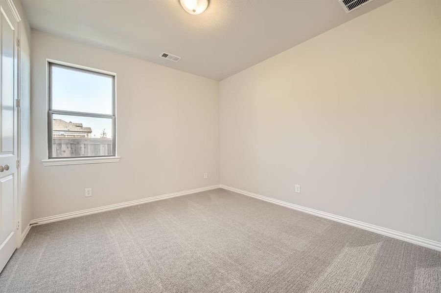 Empty room with carpet flooring