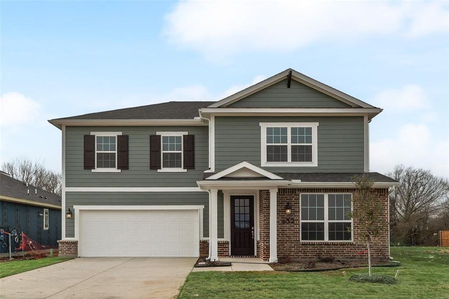Front exterior of a new home in Creekside of Crowley, Crowley, TX, highlighting curb appeal (Image 2).