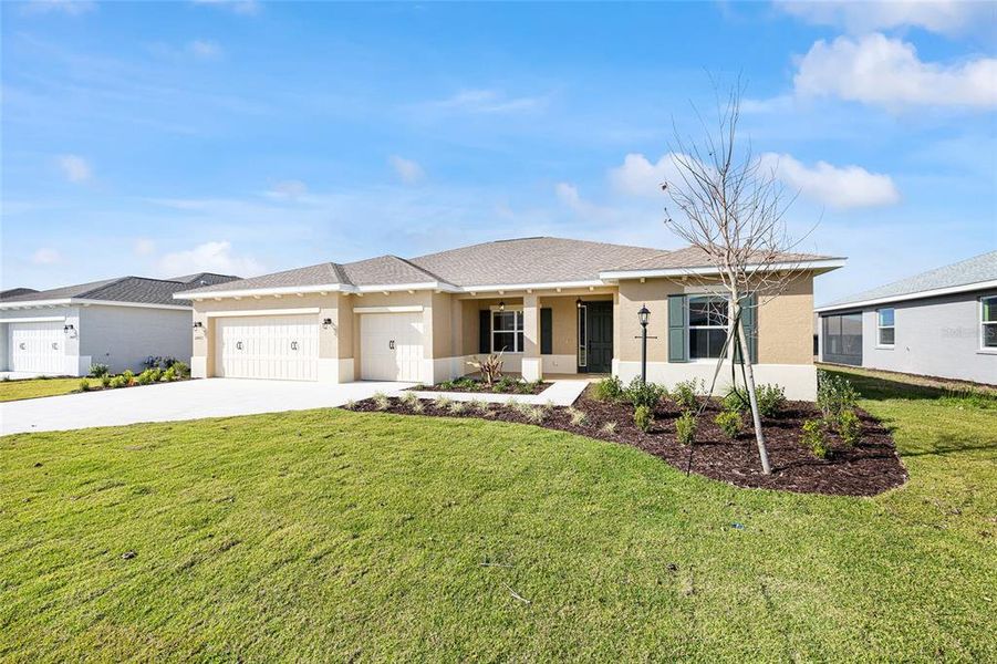 Front exterior of a new home in , Ocala, FL, highlighting curb appeal (Image 18).