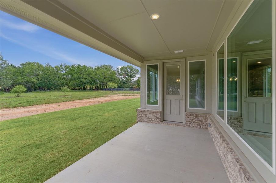 Covered patio with a concrete surface and recessed lighting