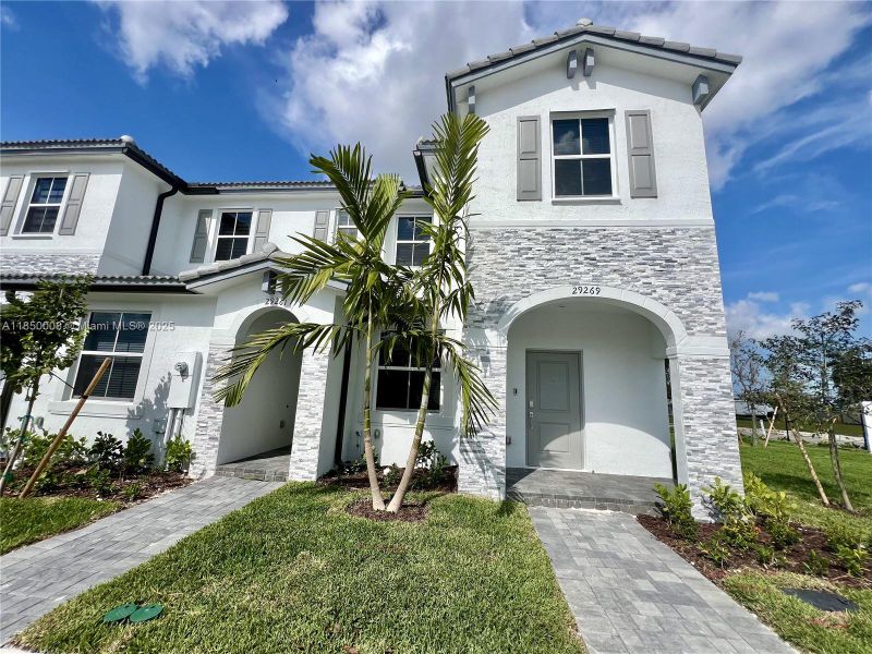 Front exterior of a new home in , Homestead, FL, highlighting curb appeal (Image 20).