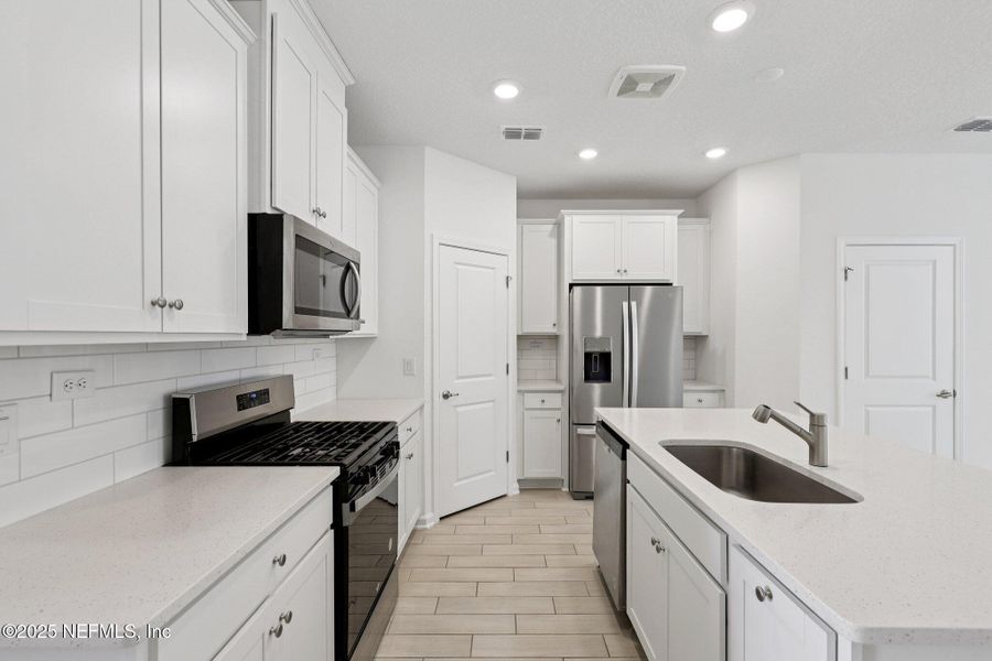 Furnished interior view inside a new home in Brandon Lakes at Silver Landing, St. Augustine (Image 6).
