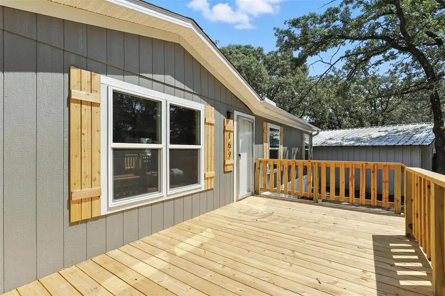 Front exterior of a new home in , Azle, TX, highlighting curb appeal (Image 1).