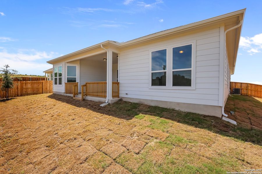 Front exterior of a new home in Homestead 65', Schertz, TX, highlighting curb appeal (Image 18).