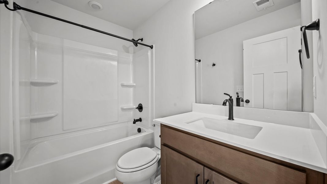 Notable full bathroom offering tasteful details and a bright, functional space