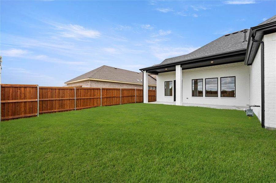 Front exterior of a new home in Talia, Mesquite, TX, highlighting curb appeal (Image 23). Front exterior of a new home in Talia, Mesquite, TX, highlighting curb appeal (Image 23).