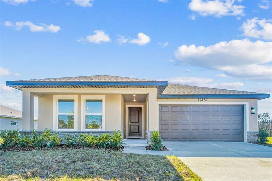 Front exterior of a new home in , Spring Hill, FL, highlighting curb appeal (Image 28).