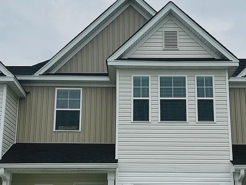 Front exterior of a new home in Percival Village, Columbia, SC, highlighting curb appeal (Image 1). Front exterior of a new home in Percival Village, Columbia, SC, highlighting curb appeal (Image 1).