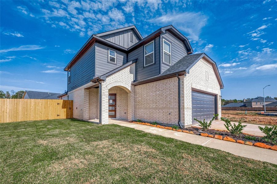 Exterior details and patio area of a home in Mill Creek Trails, Magnolia (Image 24).