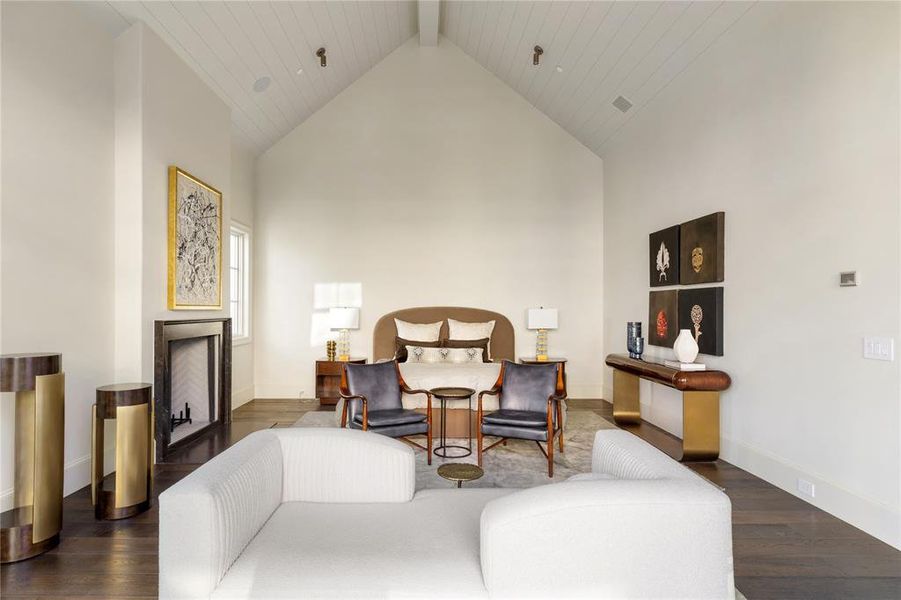 Sitting room featuring high vaulted ceiling, beamed ceiling, and dark wood-style flooring Sitting room featuring high vaulted ceiling, beamed ceiling, and dark wood-style flooring