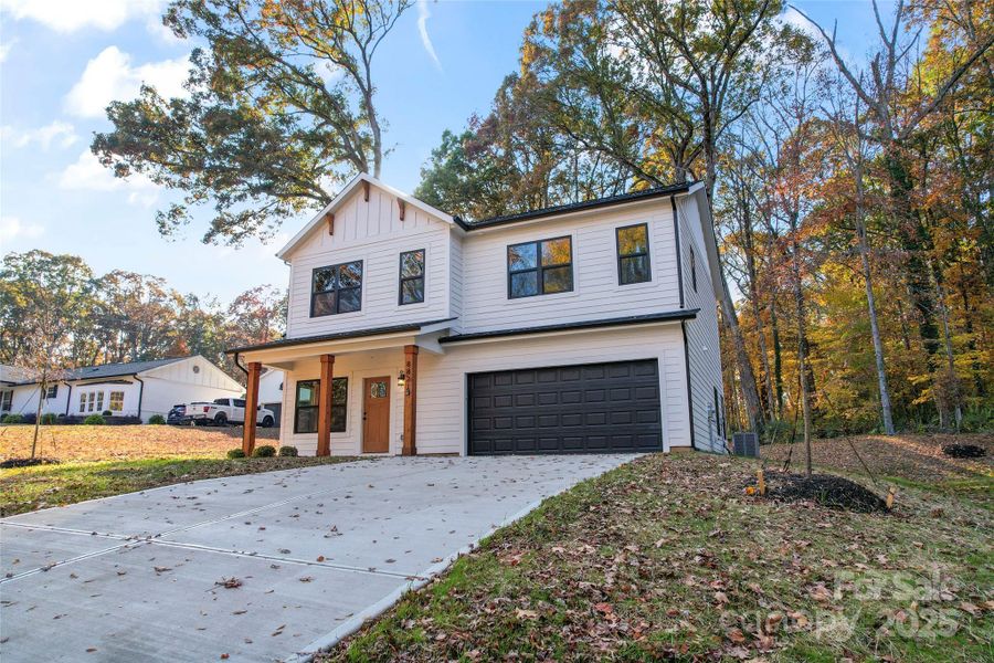 Front exterior of a new home in , Charlotte, NC, highlighting curb appeal (Image 1). Front exterior of a new home in , Charlotte, NC, highlighting curb appeal (Image 1).