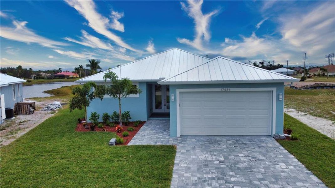 Front exterior of a new home in , Punta Gorda, FL, highlighting curb appeal (Image 26). Front exterior of a new home in , Punta Gorda, FL, highlighting curb appeal (Image 26).