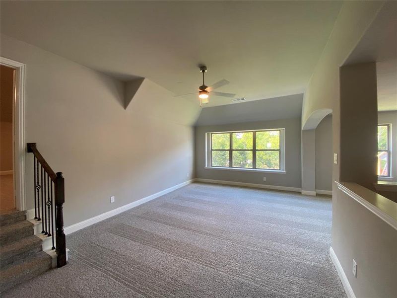 Large gameroom with ceiling fan and box out windows Large gameroom with ceiling fan and box out windows