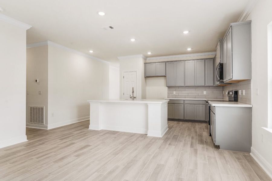 Furnished interior view inside a new home in Natureview, Freeport (Image 11).