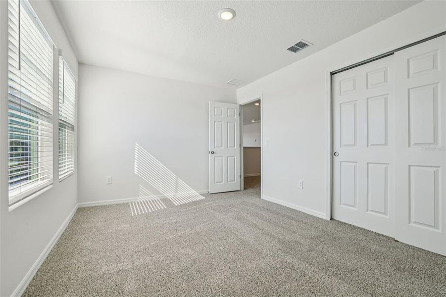 Spacious, unfurnished interior of a new home in Lake Deer Estates - Signature Series, Poinciana (Image 33).