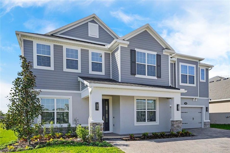 Front exterior of a new home in , Oviedo, FL, highlighting curb appeal (Image 22).