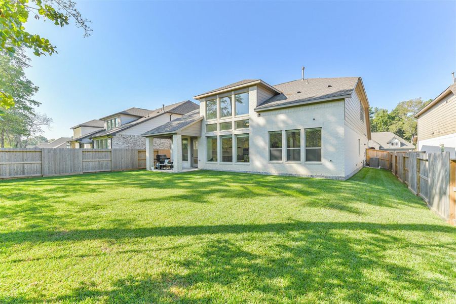 Front exterior of a new home in The Woodlands Hills – 55', Willis, TX, highlighting curb appeal (Image 27).
