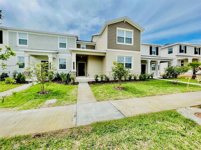 Front exterior of a new home in , Winter Garden, FL, highlighting curb appeal (Image 1). Front exterior of a new home in , Winter Garden, FL, highlighting curb appeal (Image 1).