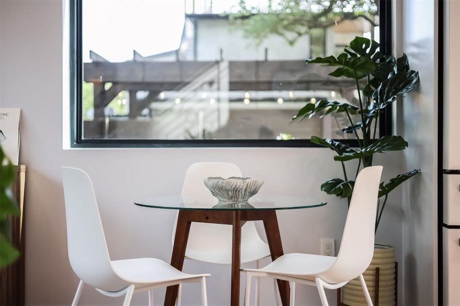 Perfectly positioned between the kitchen and the sliding glass doors, this spot turns every meal into an indoor-outdoor experience