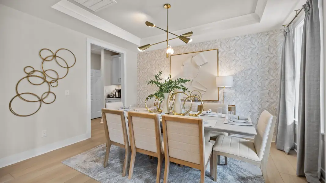 The Stonefield Home Plan in Michaux Garden by DRB Homes in Belmont, NC. - Dining Area featuring coffered ceilings