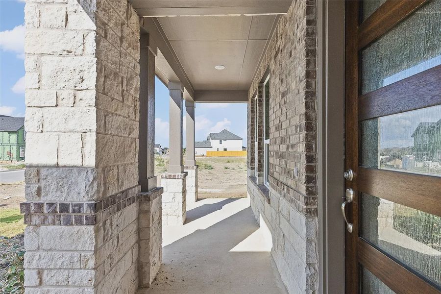 Exterior details and patio area of a home in The Grove at Blackhawk, Pflugerville (Image 3).
