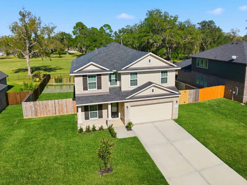 Beautiful Two-Story Home by CastleRock Communities! Featuring a timeless brick and wood elevation, this home exudes curb appeal with its charming covered front porch and neatly landscaped yard. The 2-car garage and extended driveway provide ample parking, while the clean architectural lines and designer details showcase modern craftsmanship. Inside, you’ll find an open-concept layout with soaring ceilings and elegant finishes designed for comfort and style.