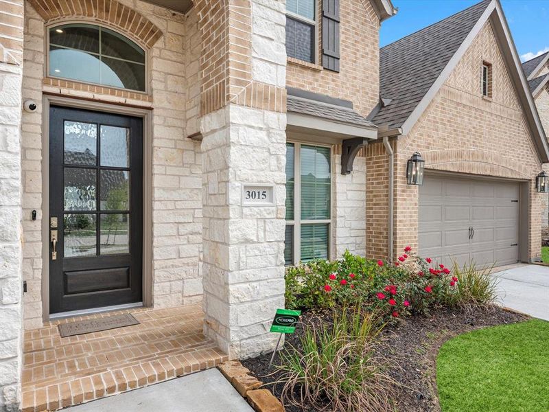 Majestic brick + stone elevation