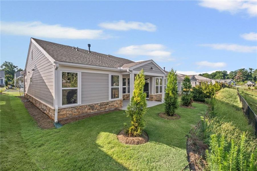 Front exterior of a new home in Laurel Farms, Dallas, GA, highlighting curb appeal (Image 33). Front exterior of a new home in Laurel Farms, Dallas, GA, highlighting curb appeal (Image 33).