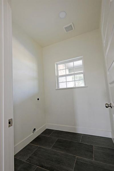 Laundry room with baseboards and hookup for an electric dryer Laundry room with baseboards and hookup for an electric dryer