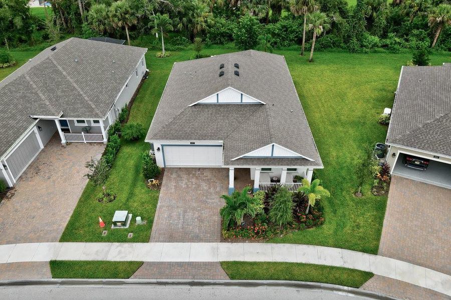 Front exterior of a new home in , Vero Beach, FL, highlighting curb appeal (Image 22).