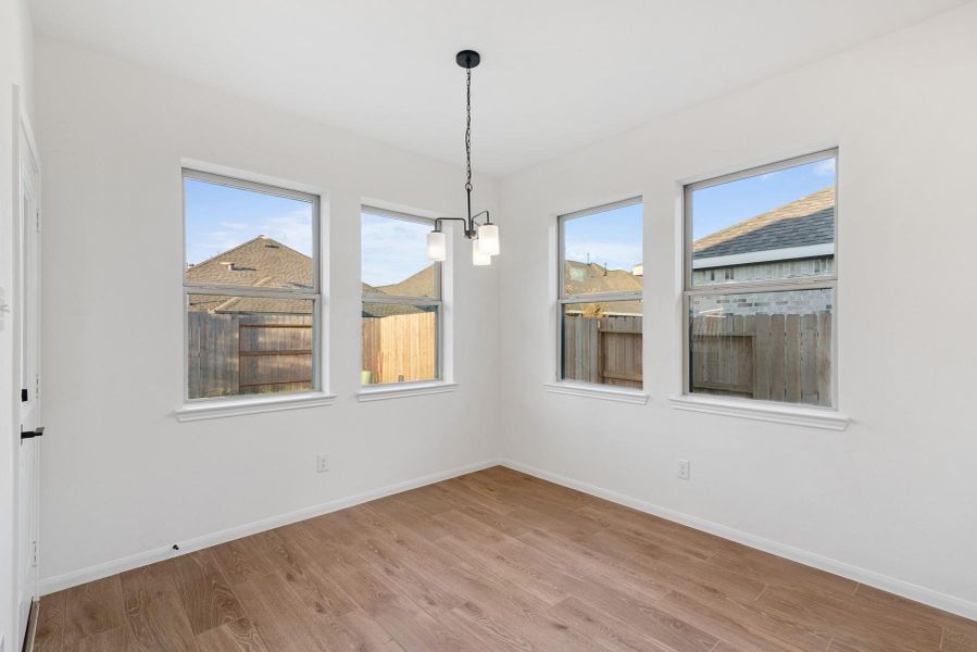 Sun-lit dining area (*Photo not of actual home and used for illustration purposes only.)