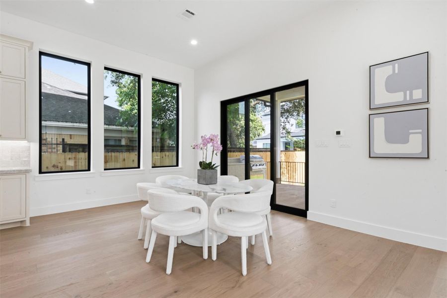 Breakfast Area with Oversized Sliding Glass Doors to the Outdoor Patio