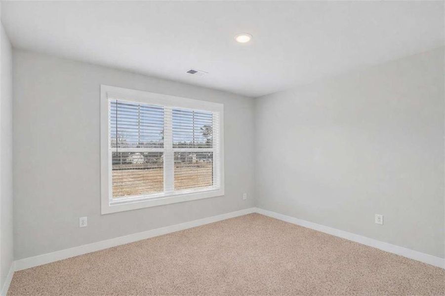 Spacious, unfurnished interior of a new home in The Fairways at Mirror Lake, Villa Rica (Image 23).