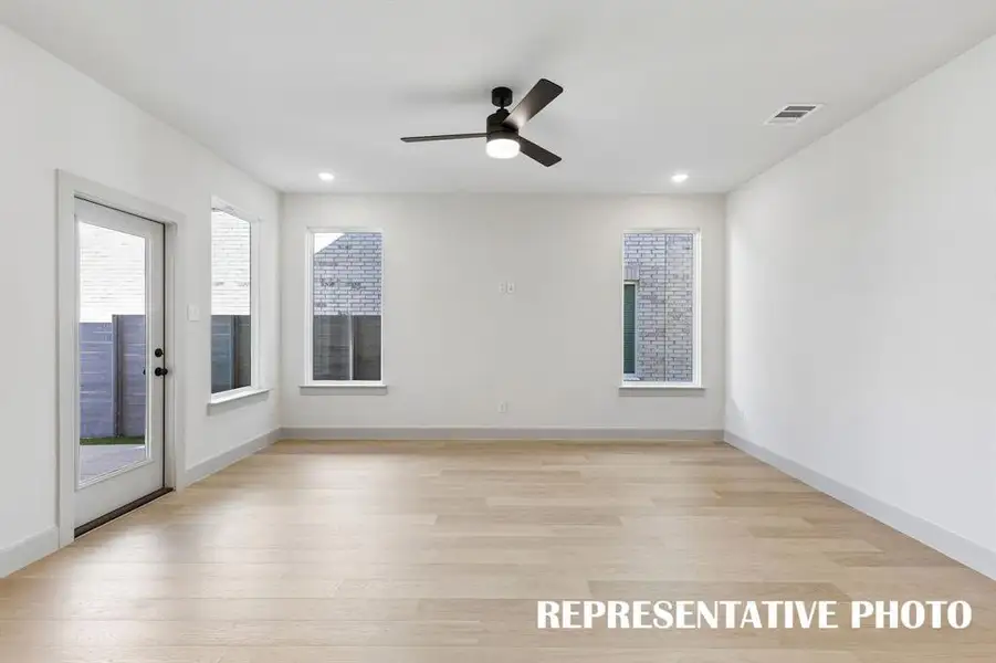 This spacious light filled family room offers a delightful space to entertain family and friends.  REPRESENTATIVE PHOTO