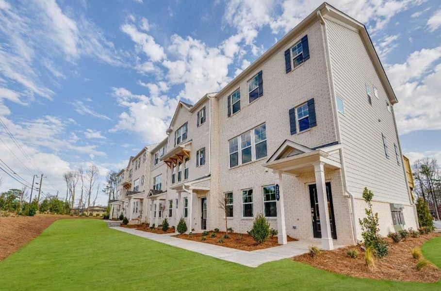 Front exterior of a new home in Somerset at Veterans Memorial, Mableton, GA, highlighting curb appeal (Image 1). Front exterior of a new home in Somerset at Veterans Memorial, Mableton, GA, highlighting curb appeal (Image 1).