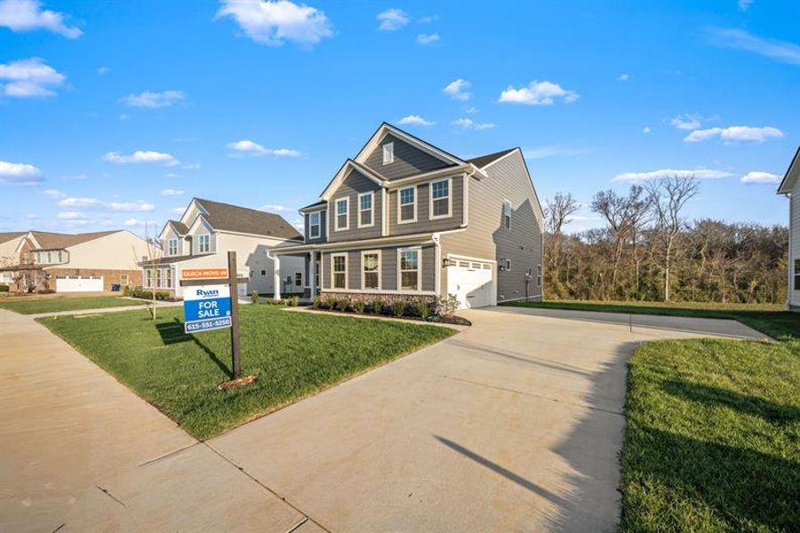 Front exterior of a new home in Muirwood, Murfreesboro, TN, highlighting curb appeal (Image 2). Front exterior of a new home in Muirwood, Murfreesboro, TN, highlighting curb appeal (Image 2).