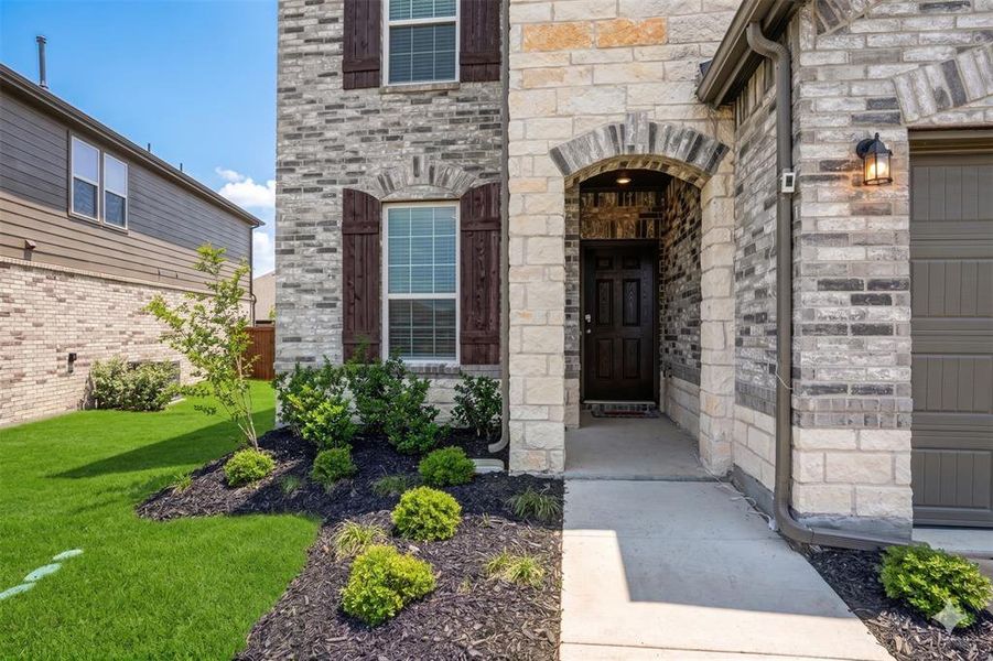 Exterior details and patio area of a home in Whitewing Trails, Princeton (Image 31).