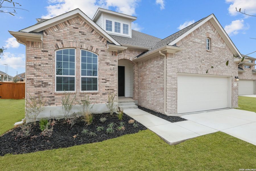 Front exterior of a new home in Foxbrook, Cibolo, TX, highlighting curb appeal (Image 2). Front exterior of a new home in Foxbrook, Cibolo, TX, highlighting curb appeal (Image 2).