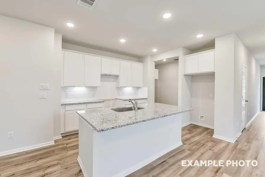 Furnished interior view inside a new home in Caney Creek Place, Conroe (Image 5).