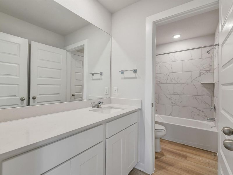 Furnished interior view inside a new home in Caney Creek Place, Conroe (Image 12).