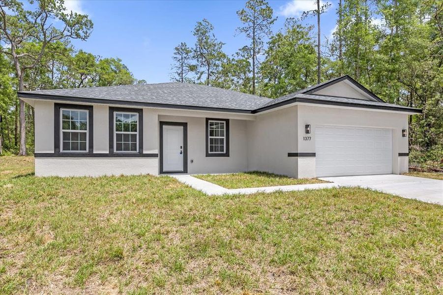 Front exterior of a new home in , Citrus Springs, FL, highlighting curb appeal (Image 21).
